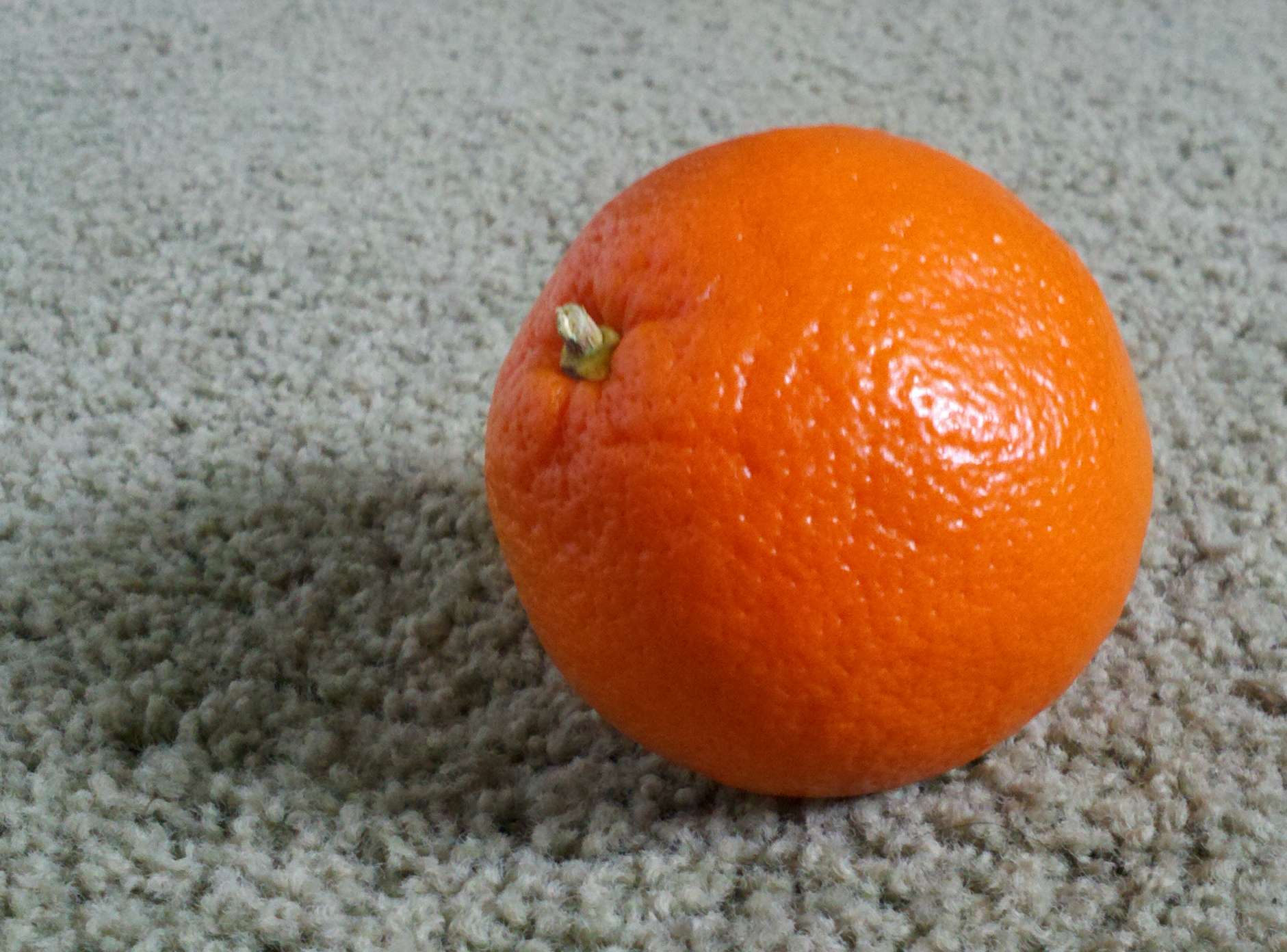 cleaning a rug with an orange